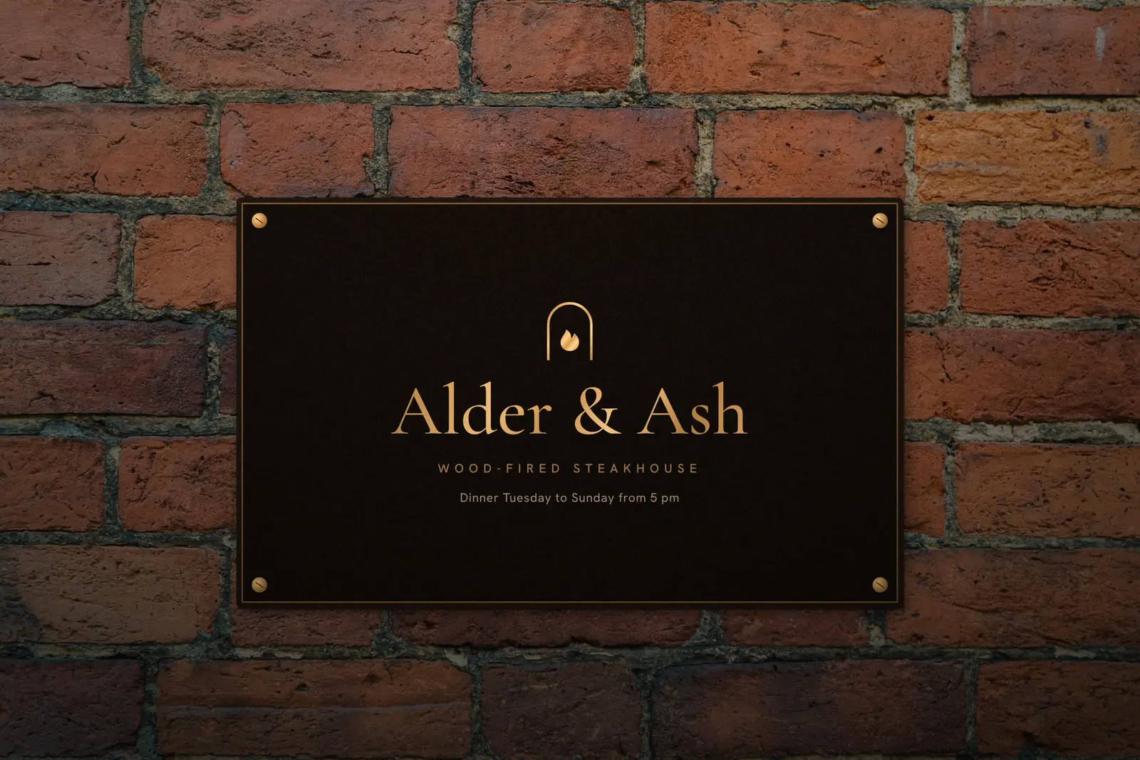Alder & Ash plaque on a brick wall